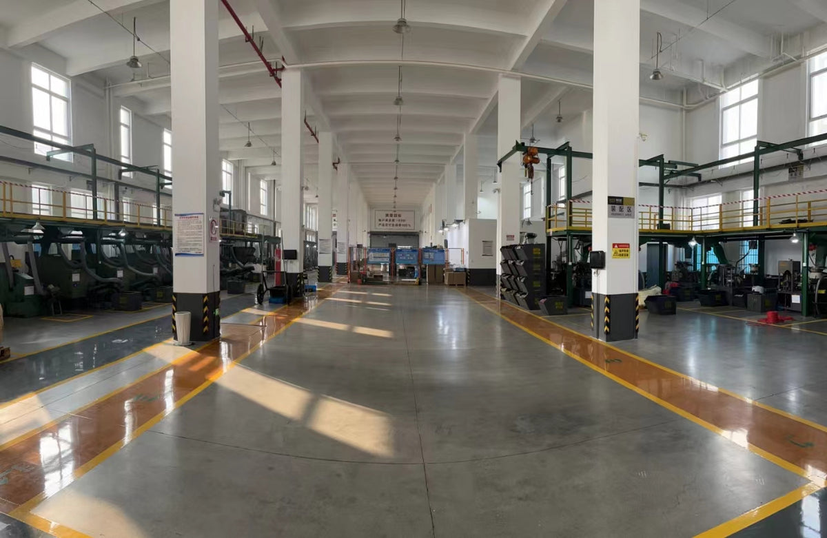 Wrapped cartons, material storage and equipment in the Milestone workshop