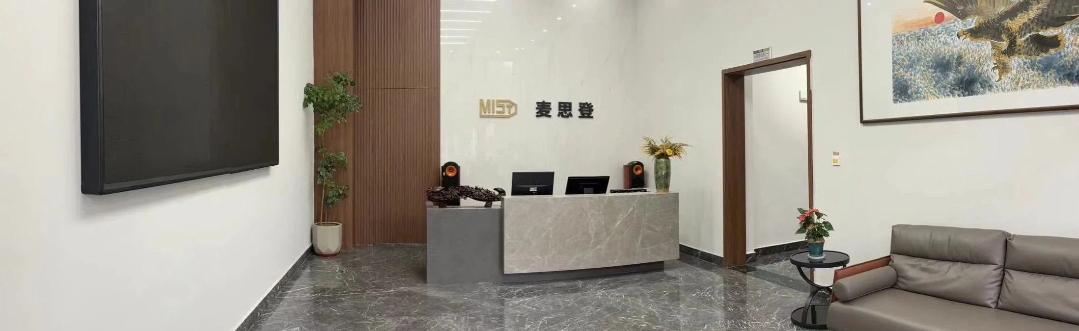 Milestone reception with the company name on the wall